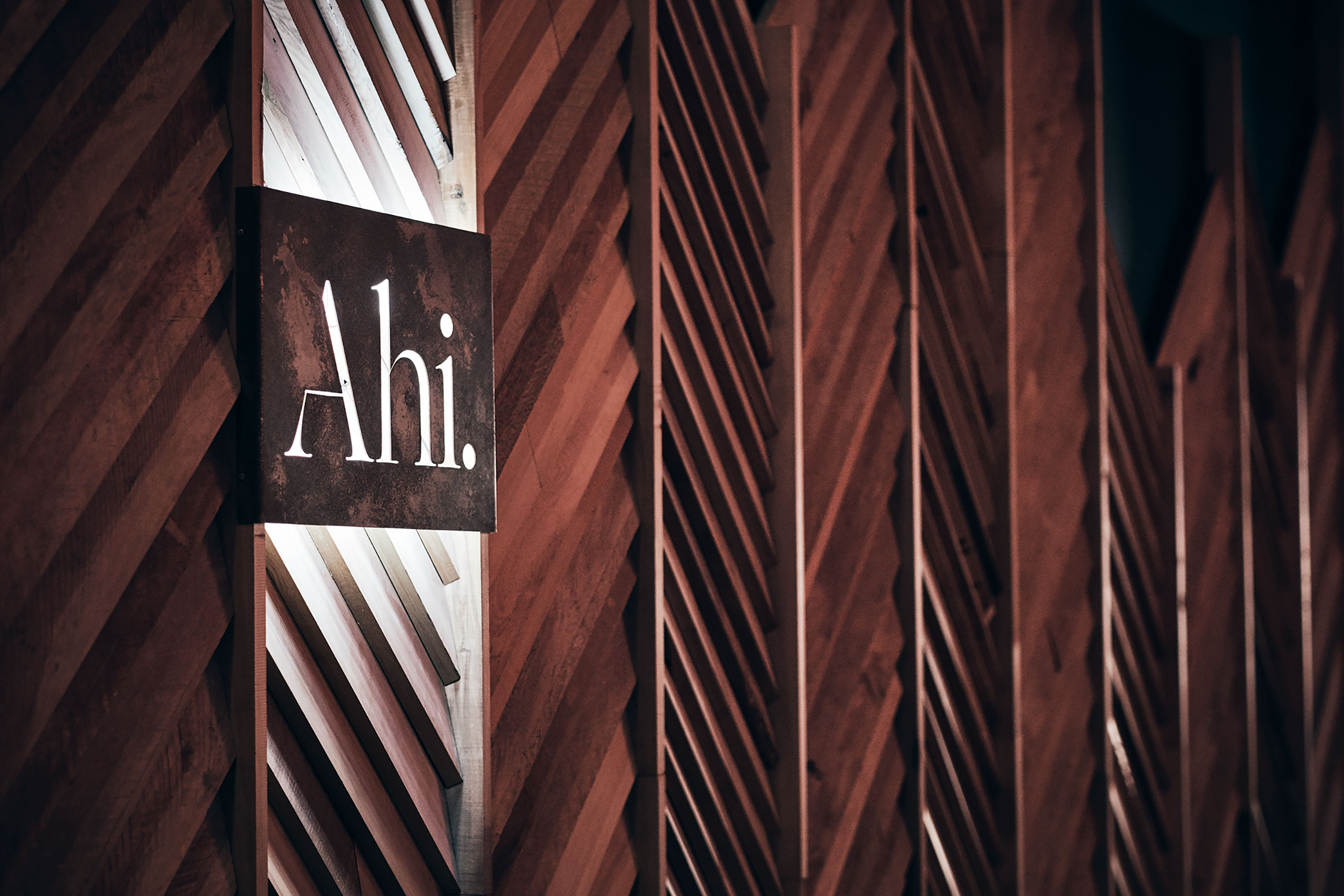 Ahi Logo Sign on Overlapping Wooden Boards • Hospitality & Culinary Food Photography