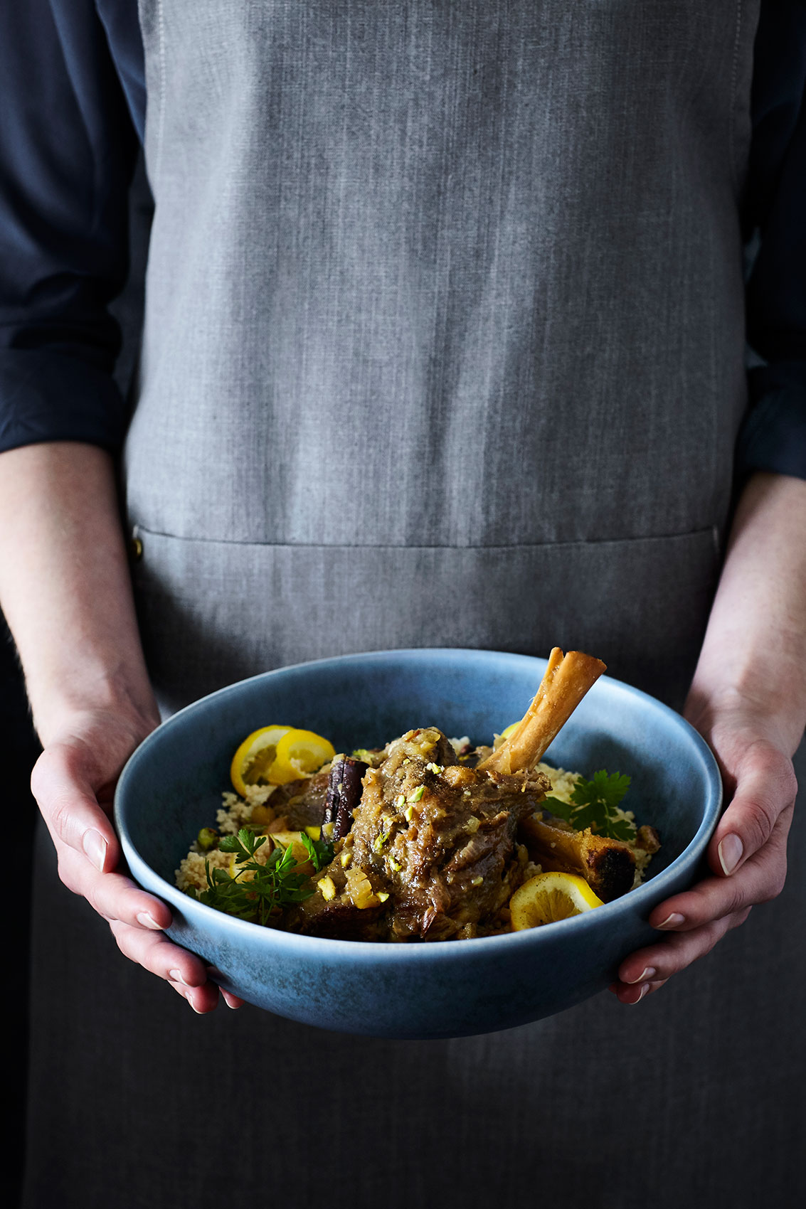 Slow Cooked • Bowl of Fragrant Lamb Shanks with Coriander & Sliced Lemon • Cookbook & Editorial Food Photography
