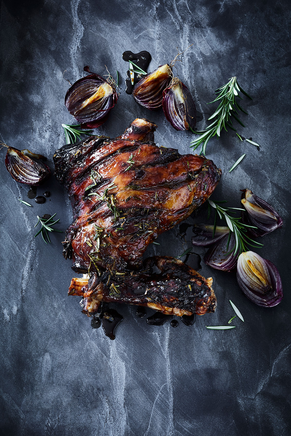 Slow Cooked • Honey Lamb Leg with Rosemary on Dark Stone Bench • Cookbook & Editorial Food Photography