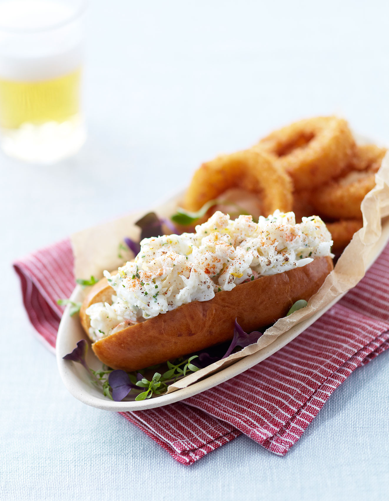 Vanilla Table • Natasha MacAller Lobster Roll with Fried Onion Rings • Cookbook & EditorialVanilla Table • Dancing Chef Smoked Trout with Sprouts & Red Onions • Cookbook & Editorial Food Photography