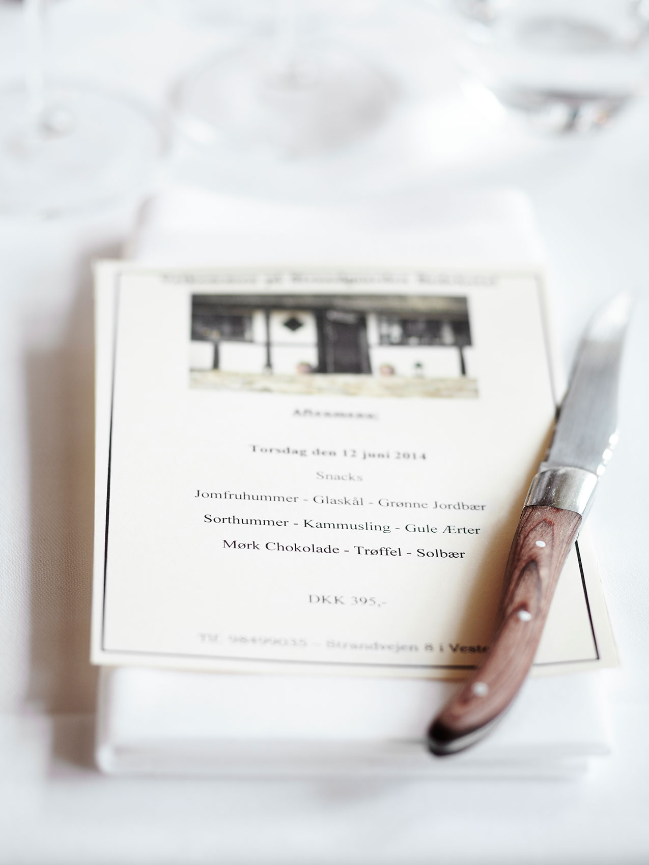 Laesoe Salt • Danish Restaurant Menu & Wood Handle Knife on Tablecloth • Advertising & Lifestyle Food Photography