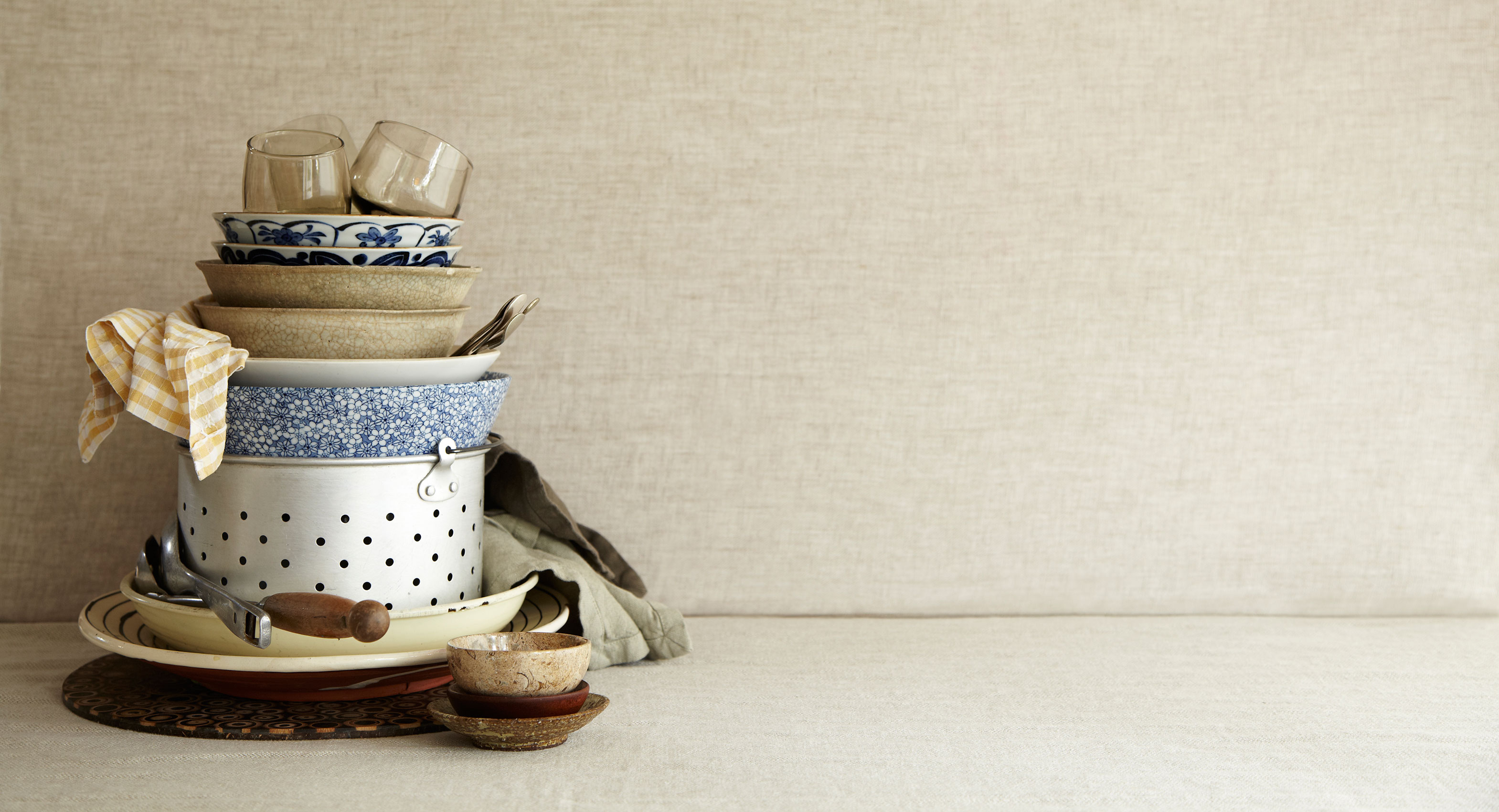 Everyday • Pasta Tableware Stacked in Colander with Tea Towels • Hospitality & Editorial Food Photography