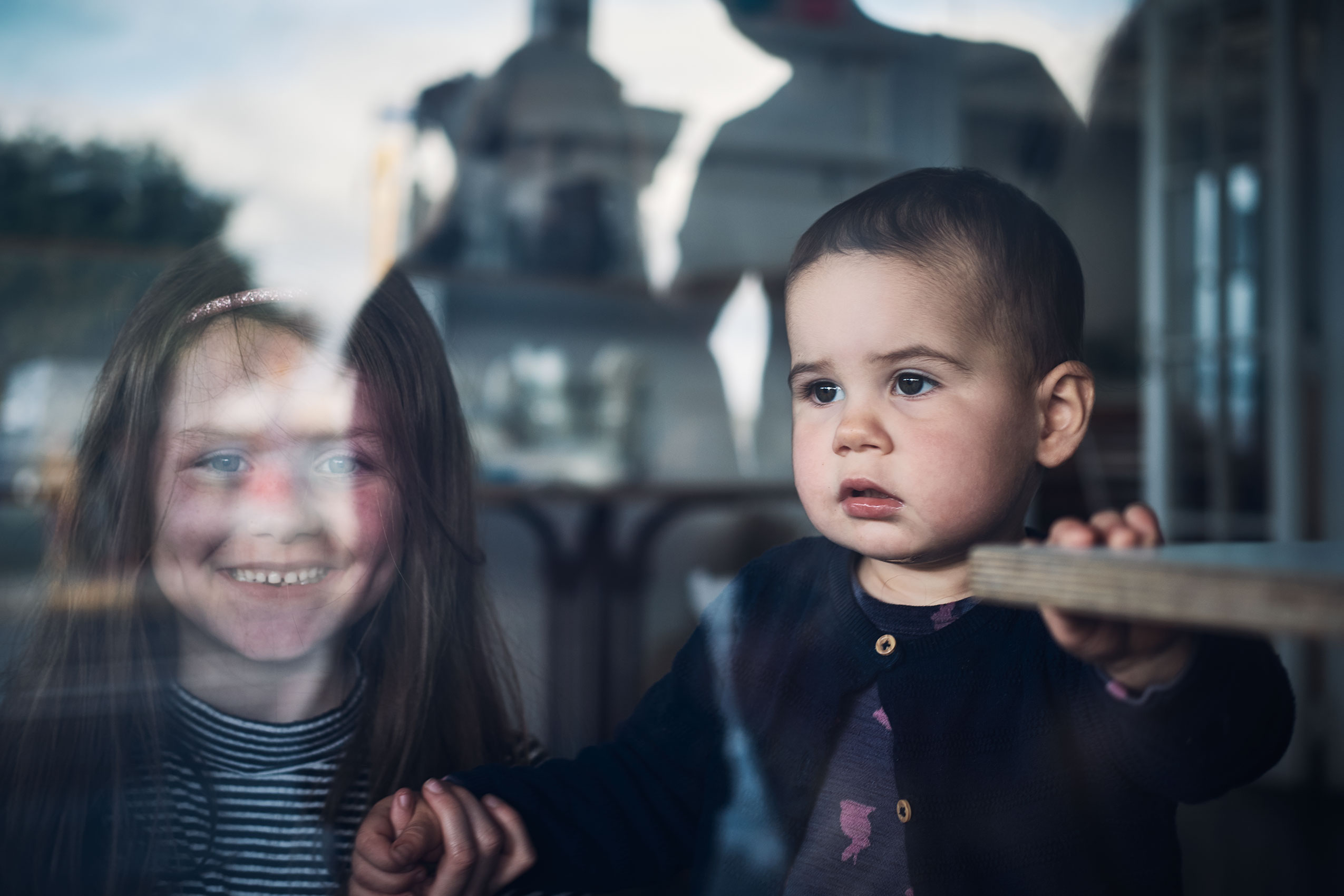 Behind Closed Doors • Family-Owned Peel to Pip Kids in Window • Lifestyle & Portrait Photography