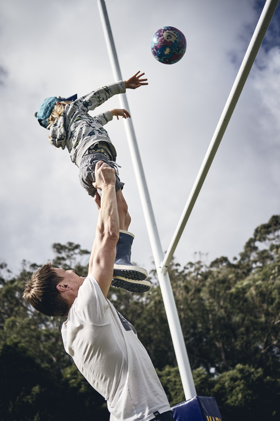 Lockdown • Young Boy Throwing Ball Over Rugby Post with Dad • Lifestyle & Portrait Photography