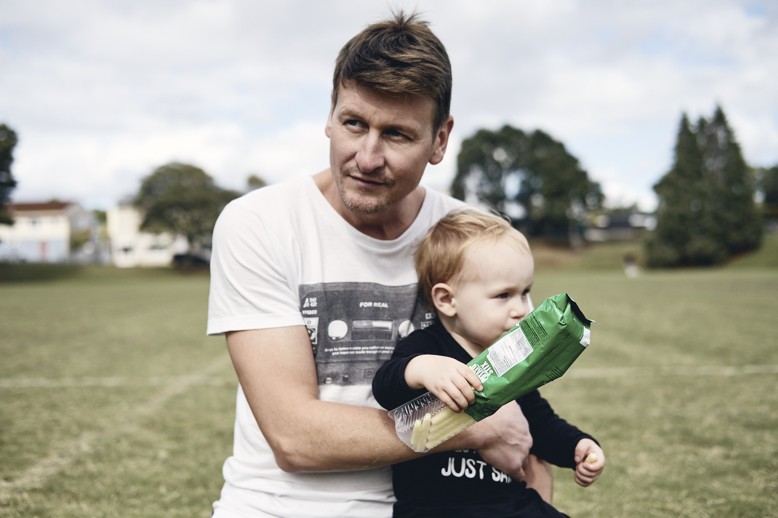 Lockdown • Toddler & Father on School Field with Snacks • Lifestyle & Portrait Photography