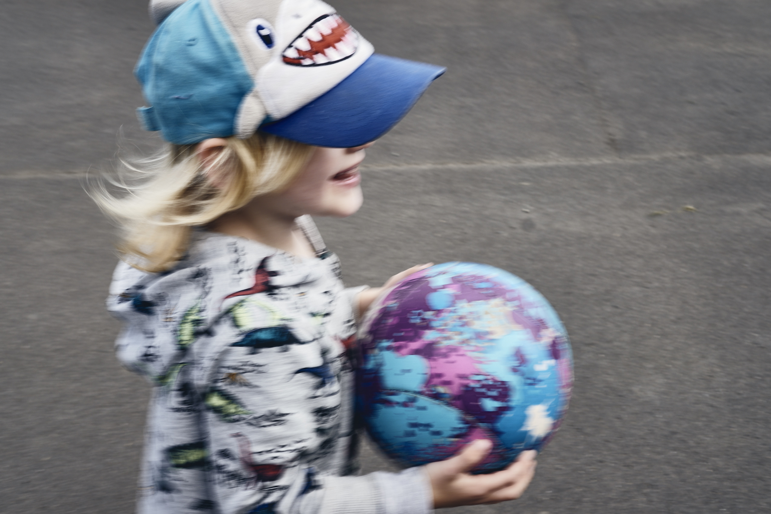 Lockdown • Young Boy in Shark Cap Playing with Paint-Splatter Ball • Lifestyle & Portrait Photography