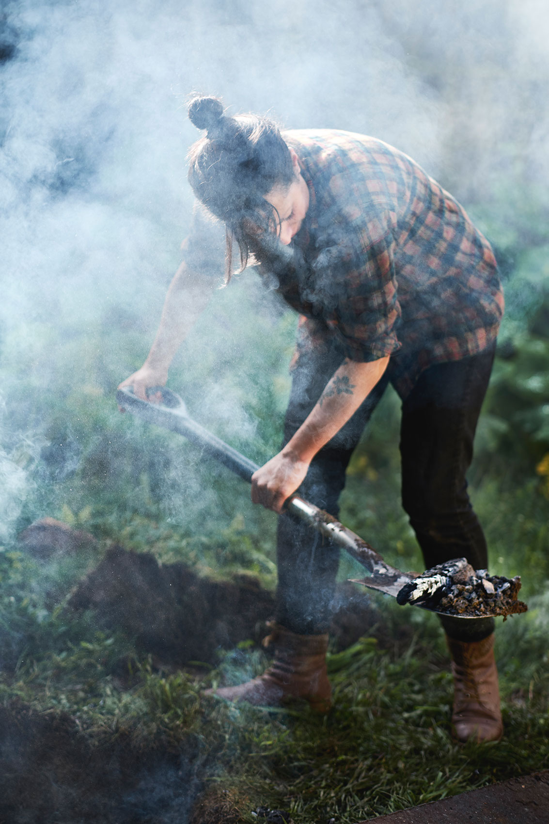 Hiakai • Monique Fiso Digging Up A Hangi Surounded by Smoke • Lifestyle & Hospitality Food Photography