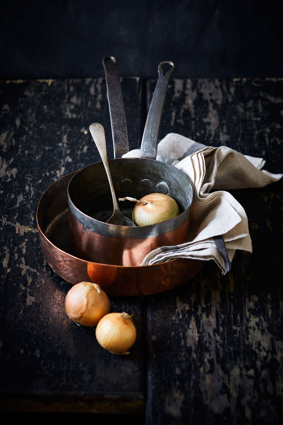 My Indian Kitchen • Copper Pots with Onions on Dark Wooden Bench • Cookbook & Editorial Food Photography