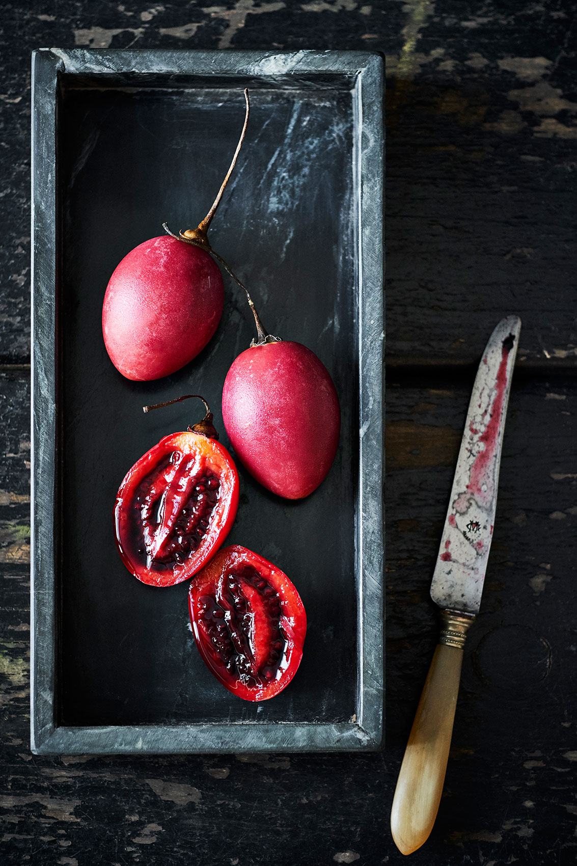My Indian Kitchen • Juicy Sliced Tamarillos in Stone Tray • Cookbook & Editorial Food Photography