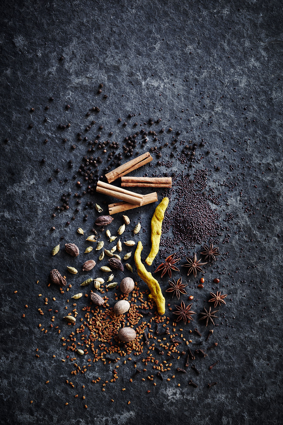 Spice Health Heroes • Mixed Dried Spices on Dark Bench Book Cover Shot  • Cookbook & Editorial Food Photography