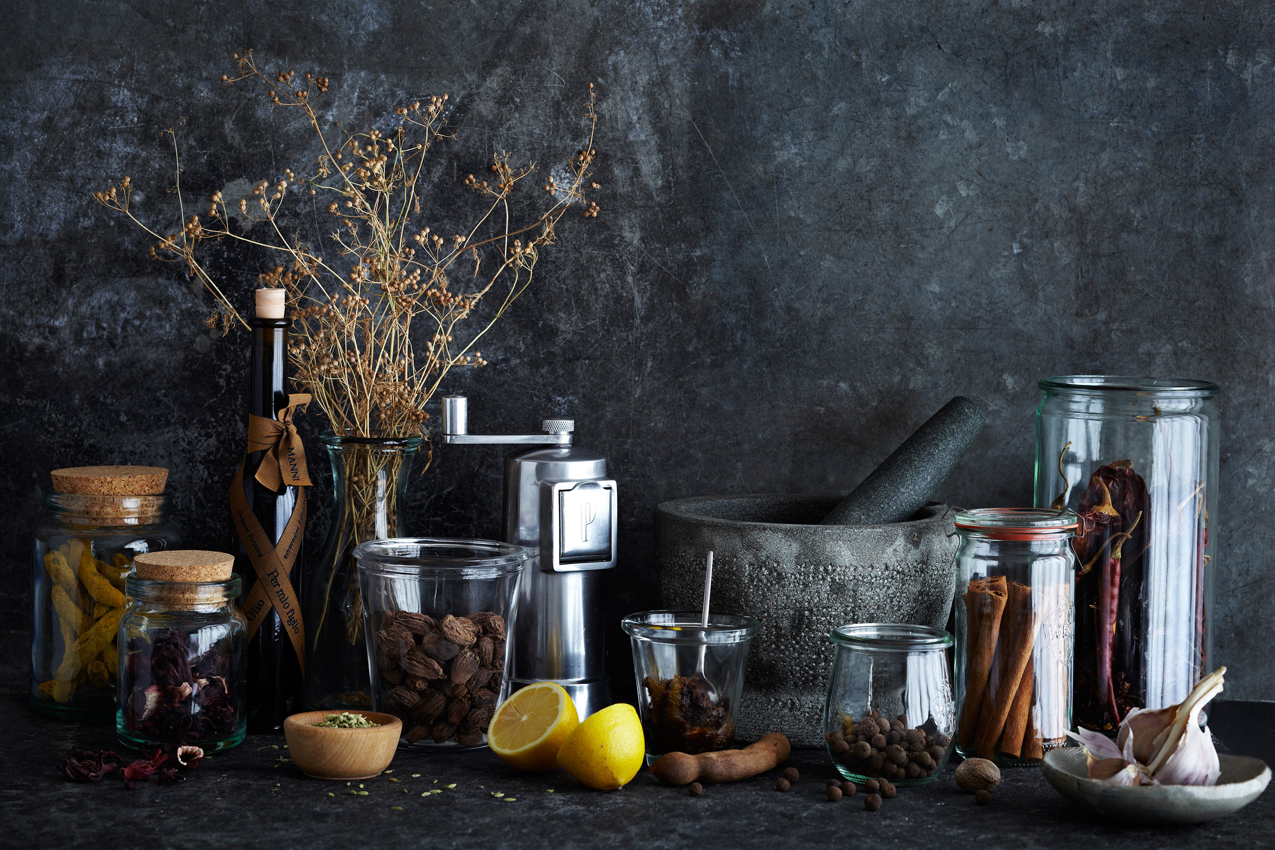 Spice Health Heroes • Dried Spices in Glass Jars on Dark Kitchen Bench • Cookbook & Editorial Food Photography